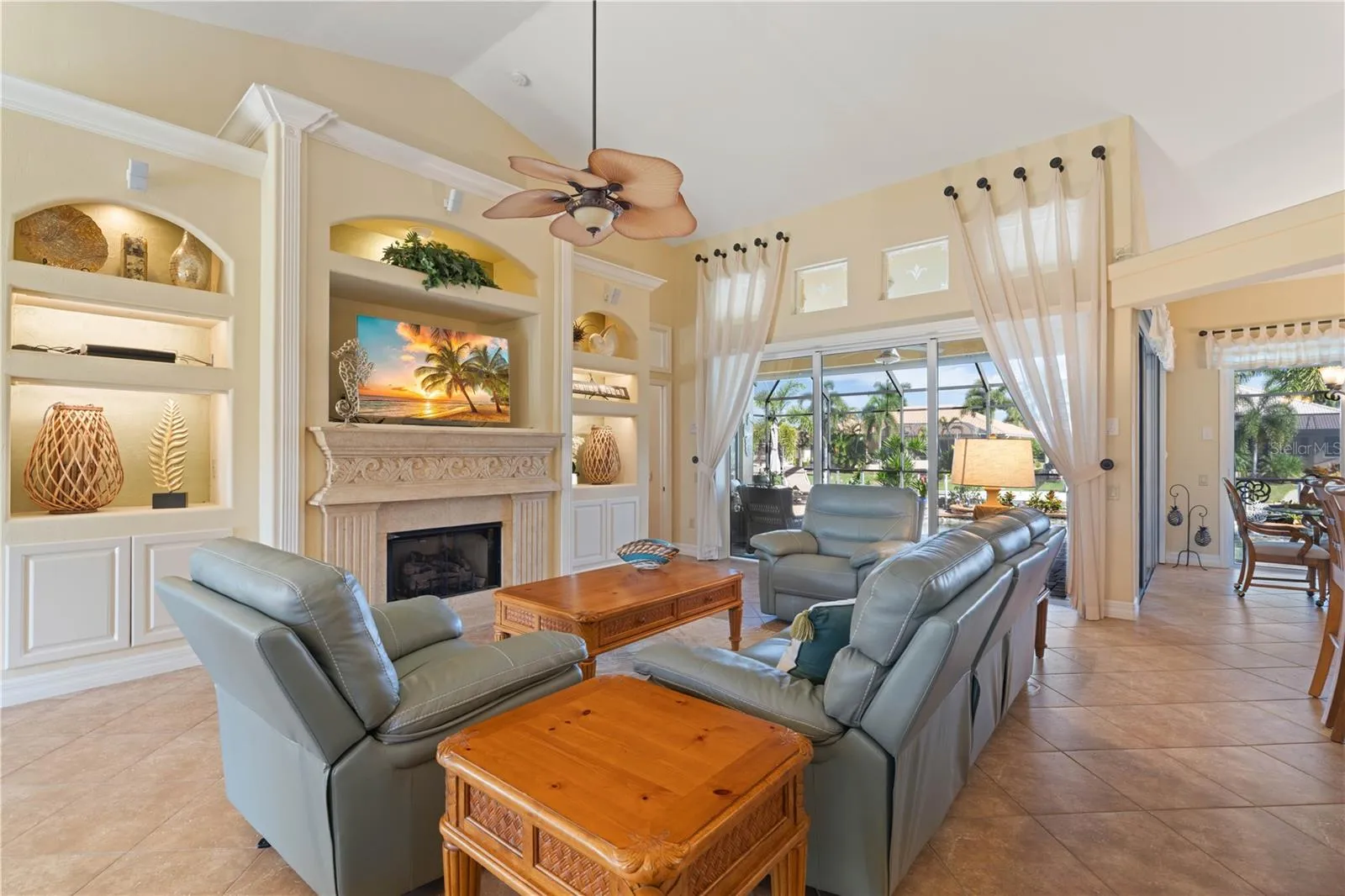 Great room with built-in fireplace and lighted display shelves
