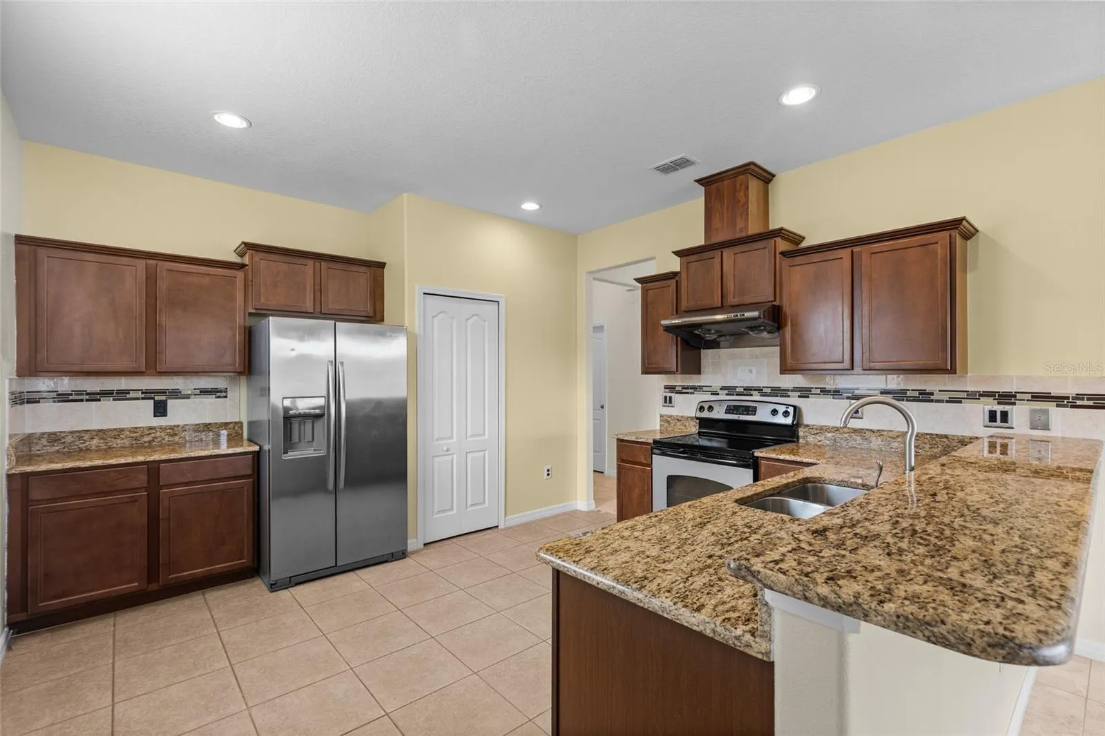 Kitchen Has Tons Of Storage With A Food Pantry