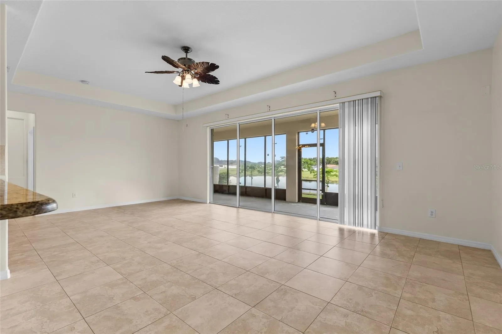 Oversized Living Room With Tray Ceilings