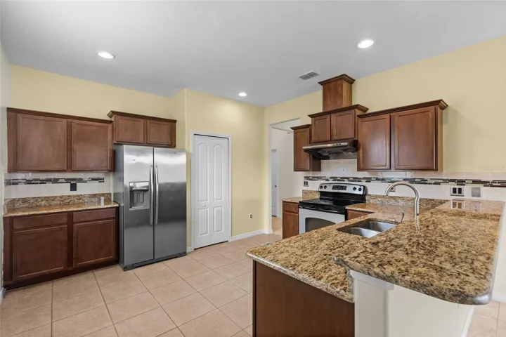 Kitchen Has Tons Of Storage With A Food Pantry