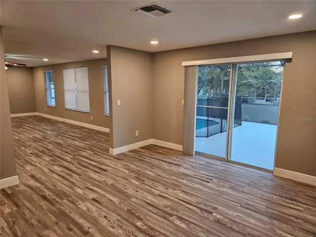 SLIDING DOORS LEADING OUT TO POOL AREA