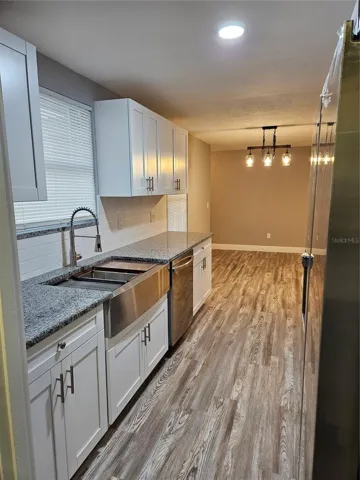 KITCHEN LOOKING OUT AT DINING AREA