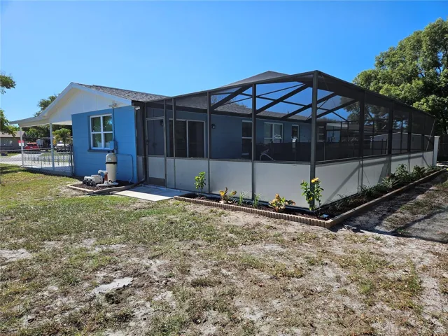 REAR OF HOME WITH POOL VIEW