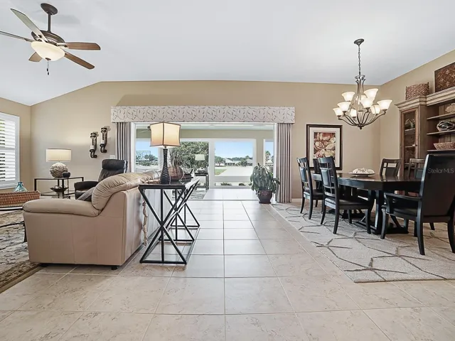Living room looking toward back of house and golf and water views