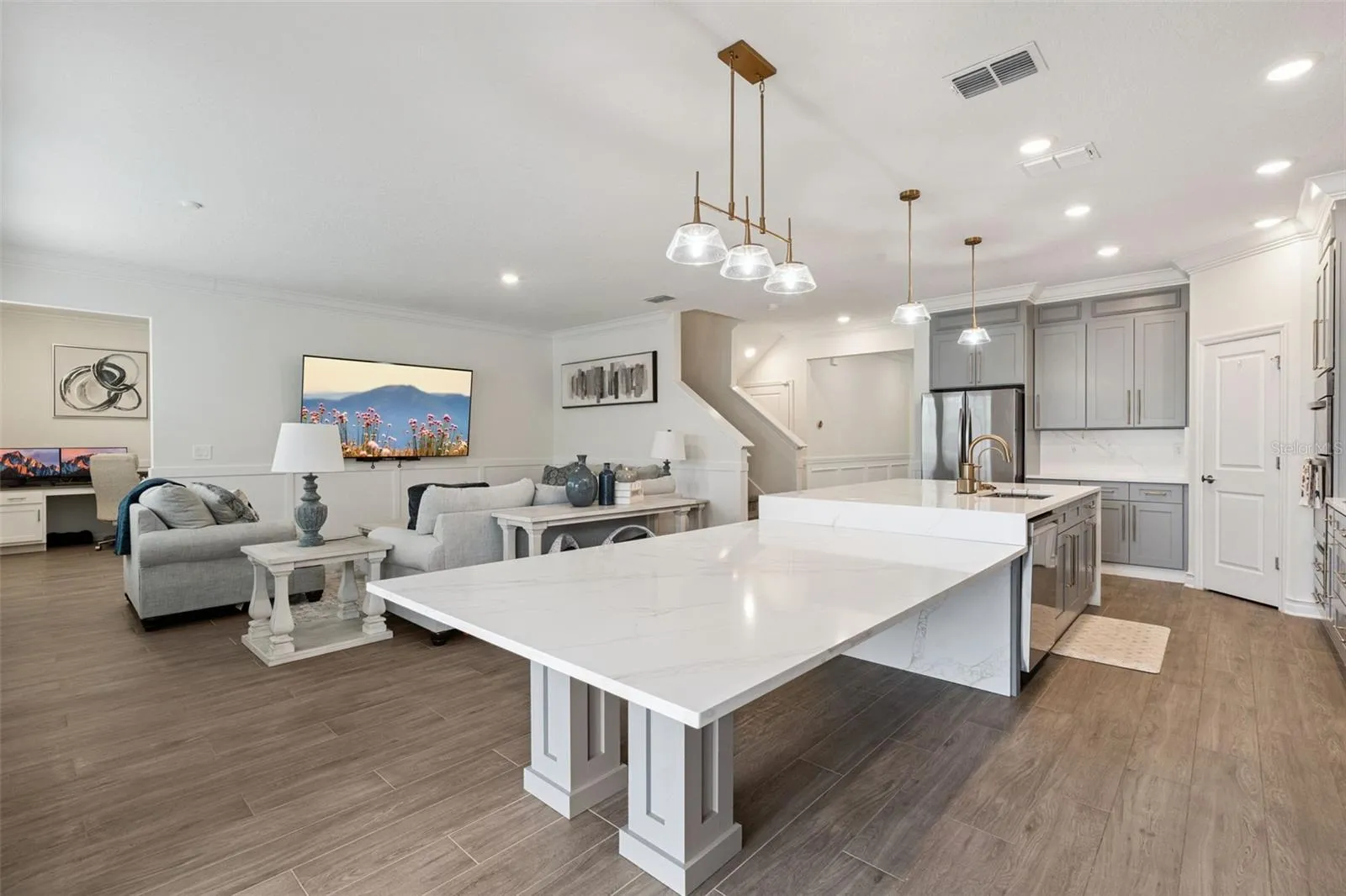 Gourmet kitchen upgrades throughout with walk in pantry, crown molding throughout