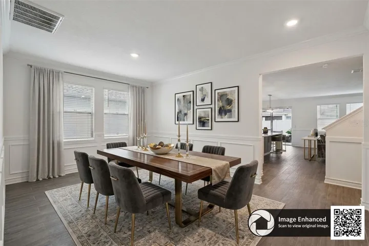 Virtually staged formal dining room area