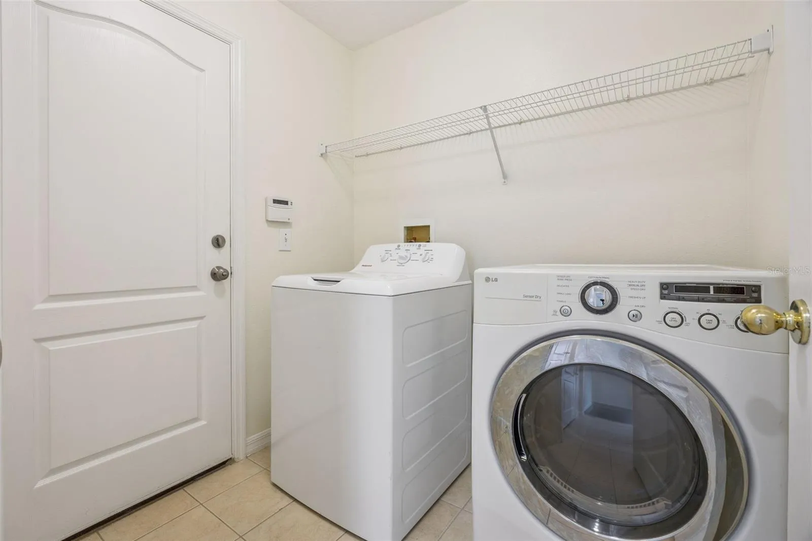 Laundry room (6'2" x 6'8") with washer, dryer and new wire shelving