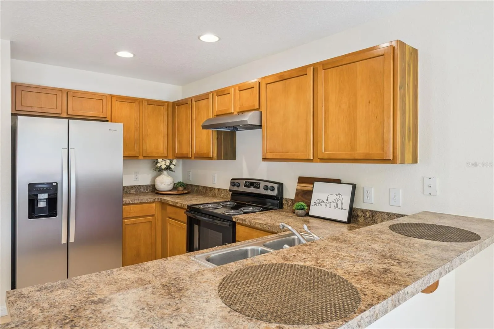 Kitchen with stainless steel appliances and counter space