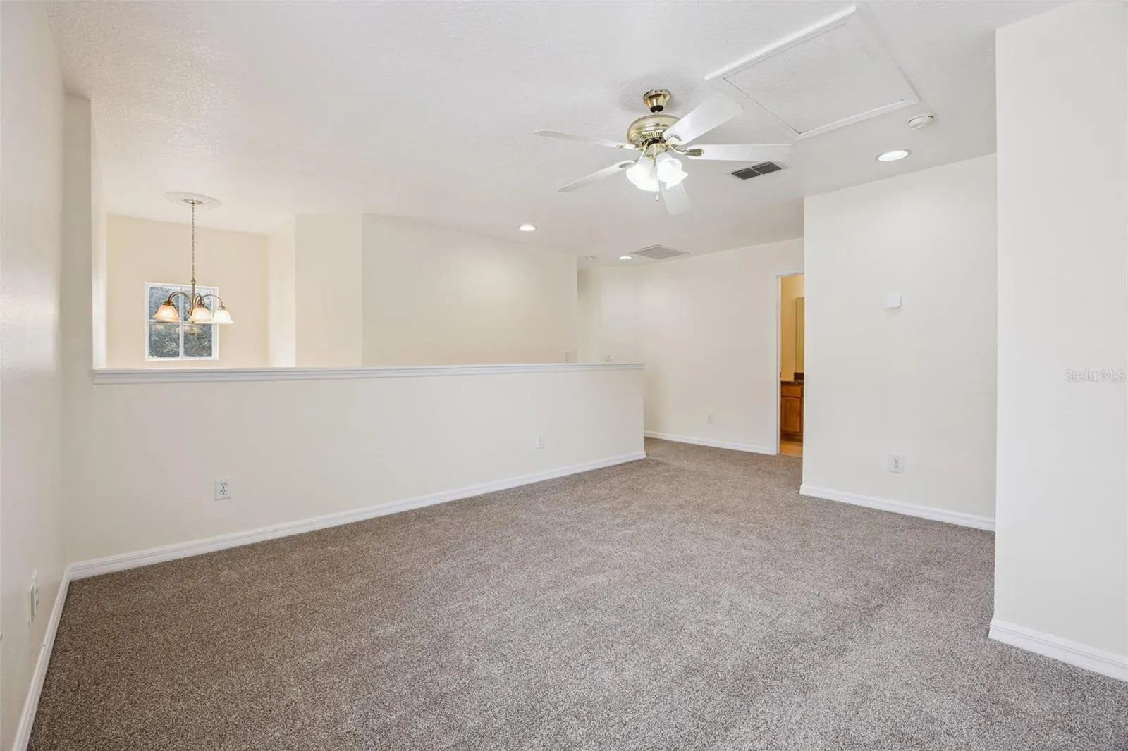 Second-floor loft (18'9" x 12'6") with new carpet