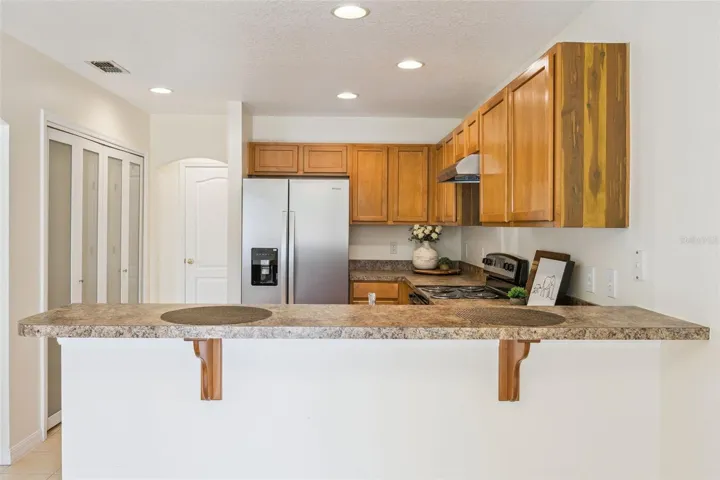 Kitchen (9'11" x 11'3") with breakfast bar and pantry