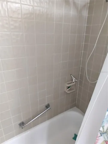 Guest bath with resurfaced tub