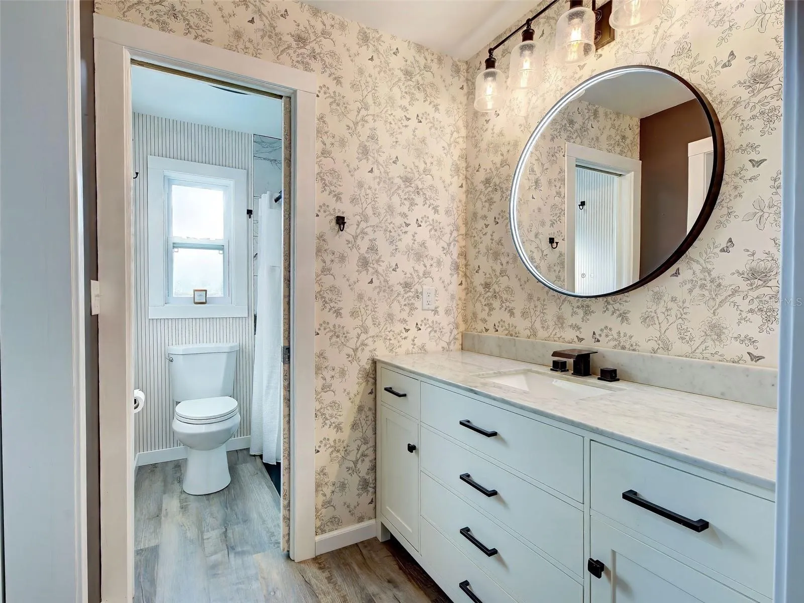 Beautifully remodeled primary bathroom is lovely.