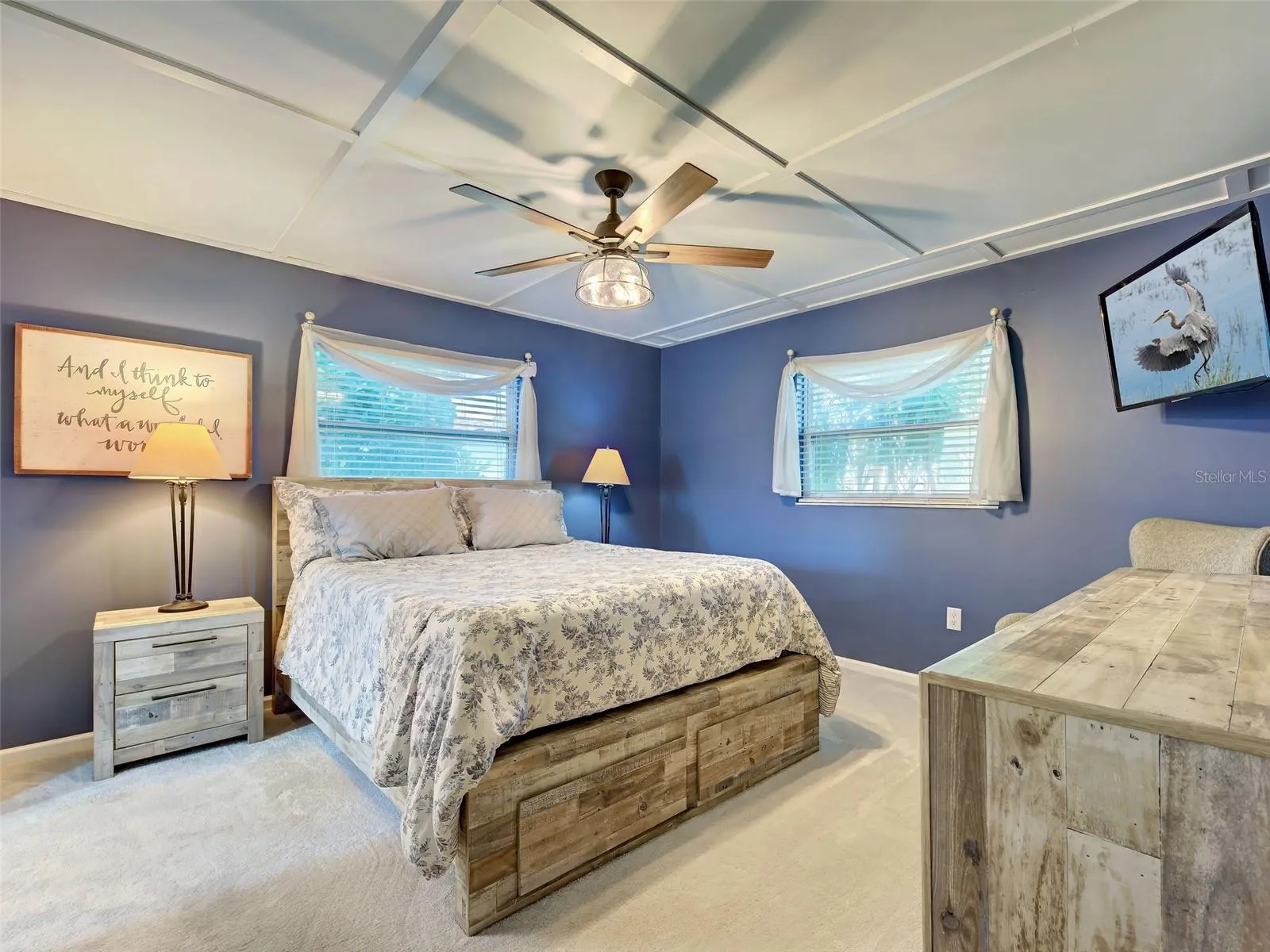 Primary bedroom has fresh beachy paint, large walk in closet and new carpet.