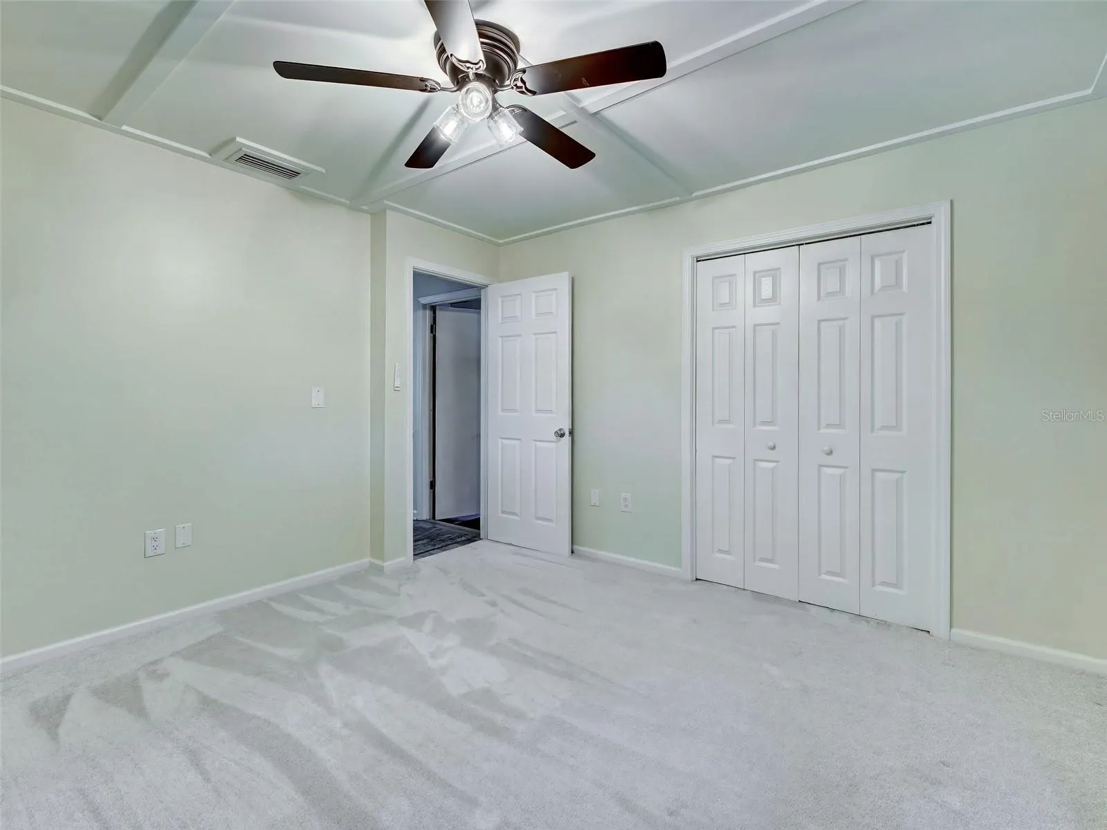2nd bedroom has new carpet, new fan and large closet.