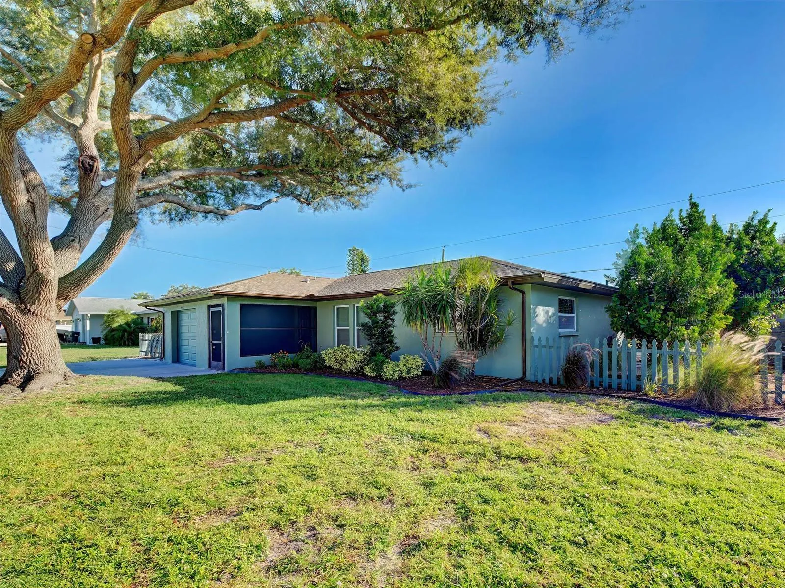 Home is set on a large lot with room for your boat or RV and is ideally located, close to many conveniences, yet tucked away on a quiet street.