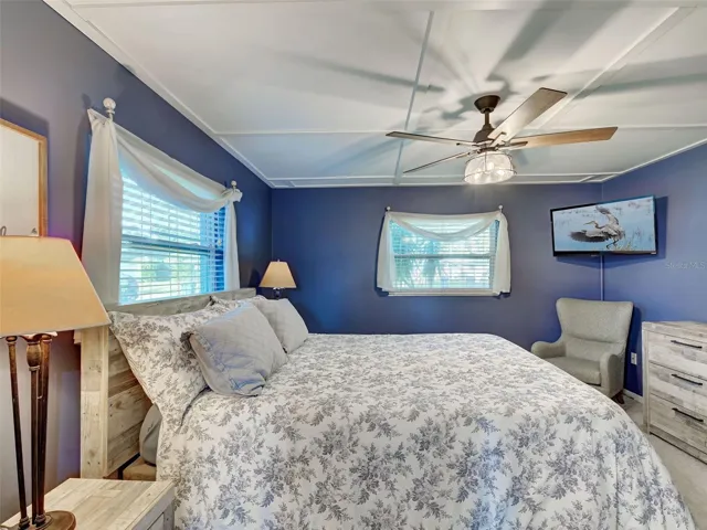 Primary bedroom has room for a King size bed and the many windows make it light and bright.