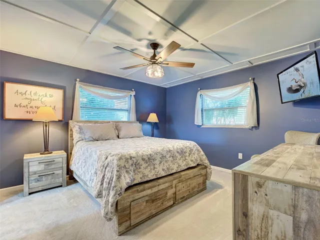 Primary bedroom has fresh beachy paint, large walk in closet and new carpet.