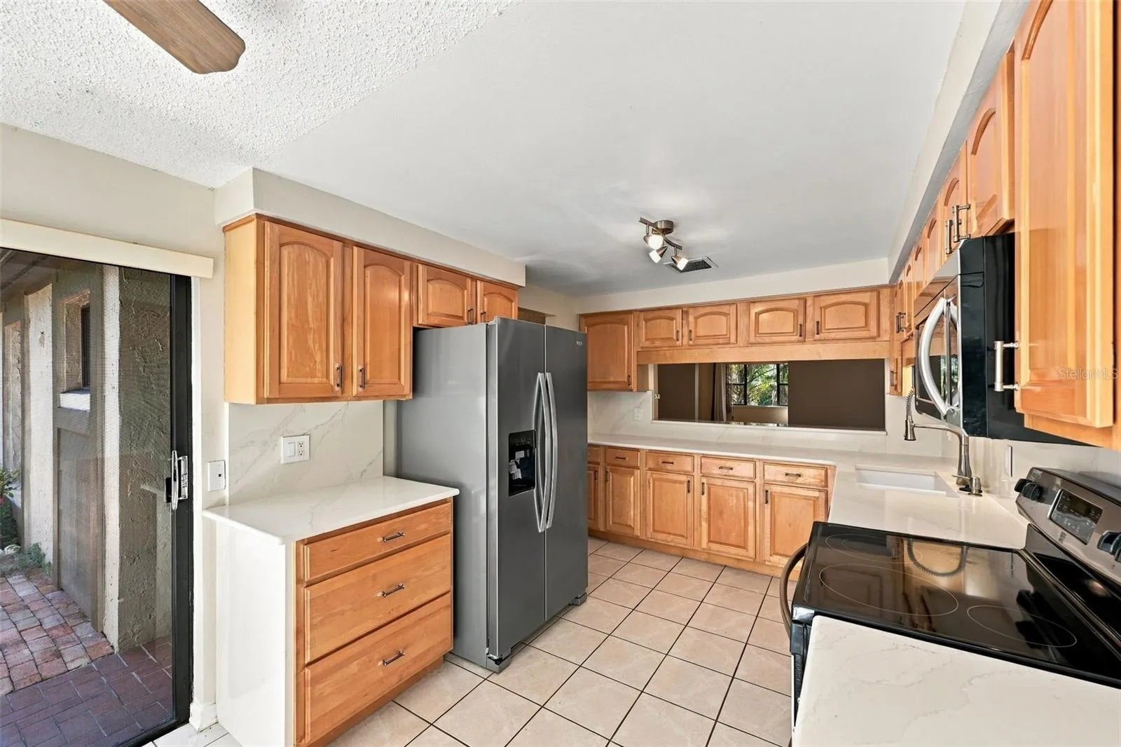Kitchen with sliders to Courtyard