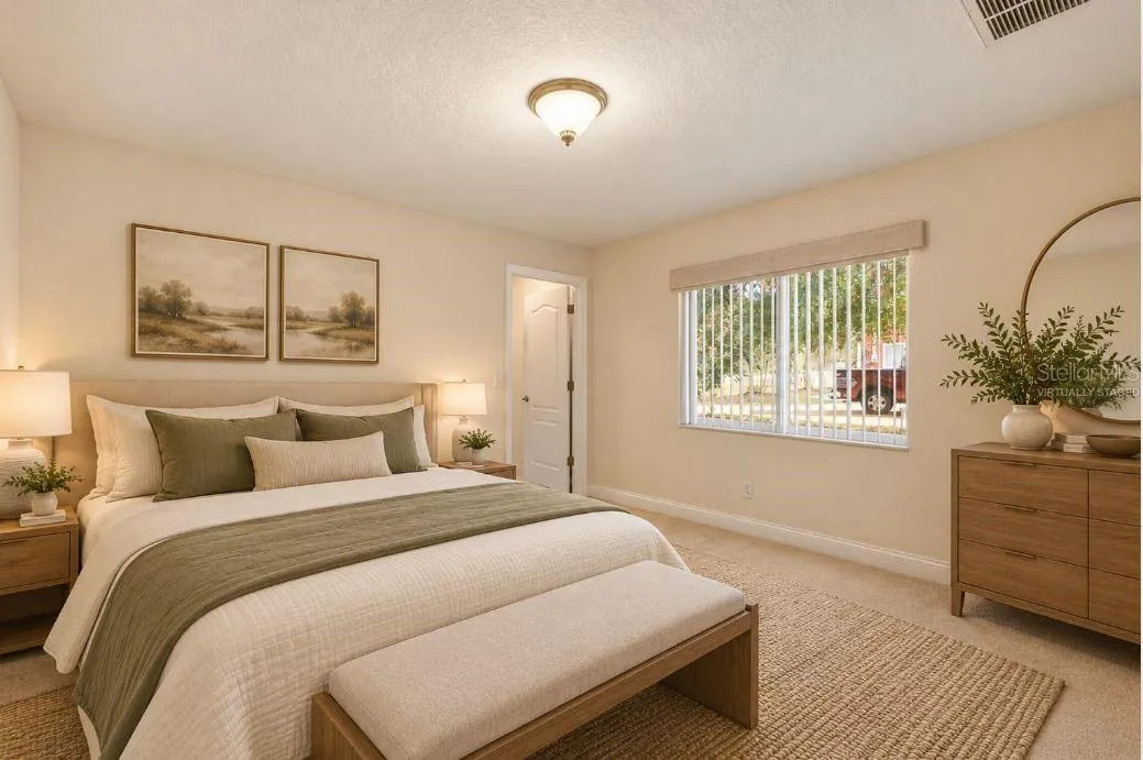 Virtually staged guest bedroom.