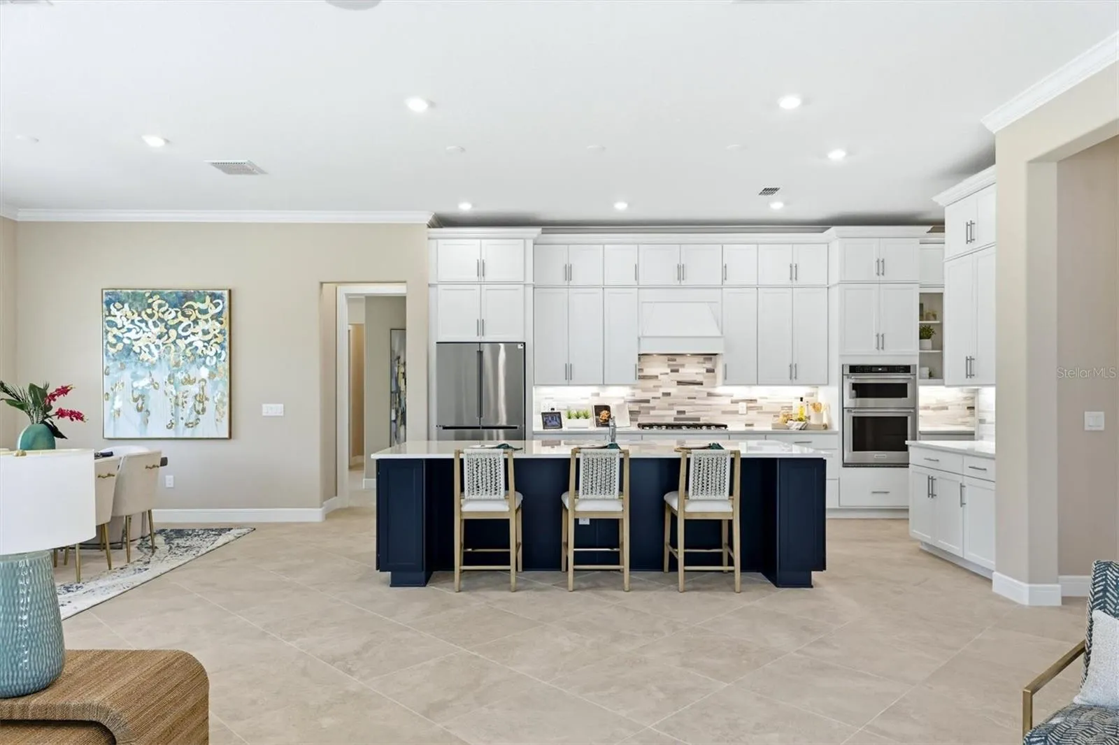 Notice the immense island with two end cap cabinets