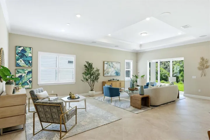 24" porcelain tile on the diagonal everywhere! While sellers never lived here, they had the custom Plantation shutters placed on all windows- NOTICE that the sitting area can also serve as a base for your dining space.This floor plan offers great flexibility