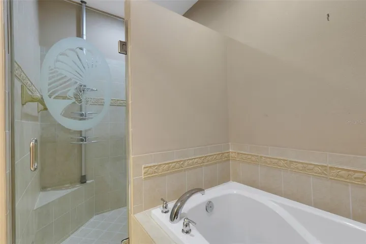Primary tub with separate walk-in shower