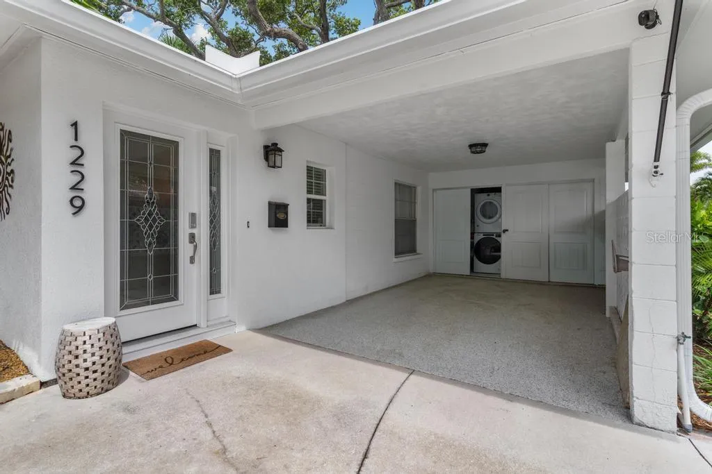Laundry and Storage Area within the Carport