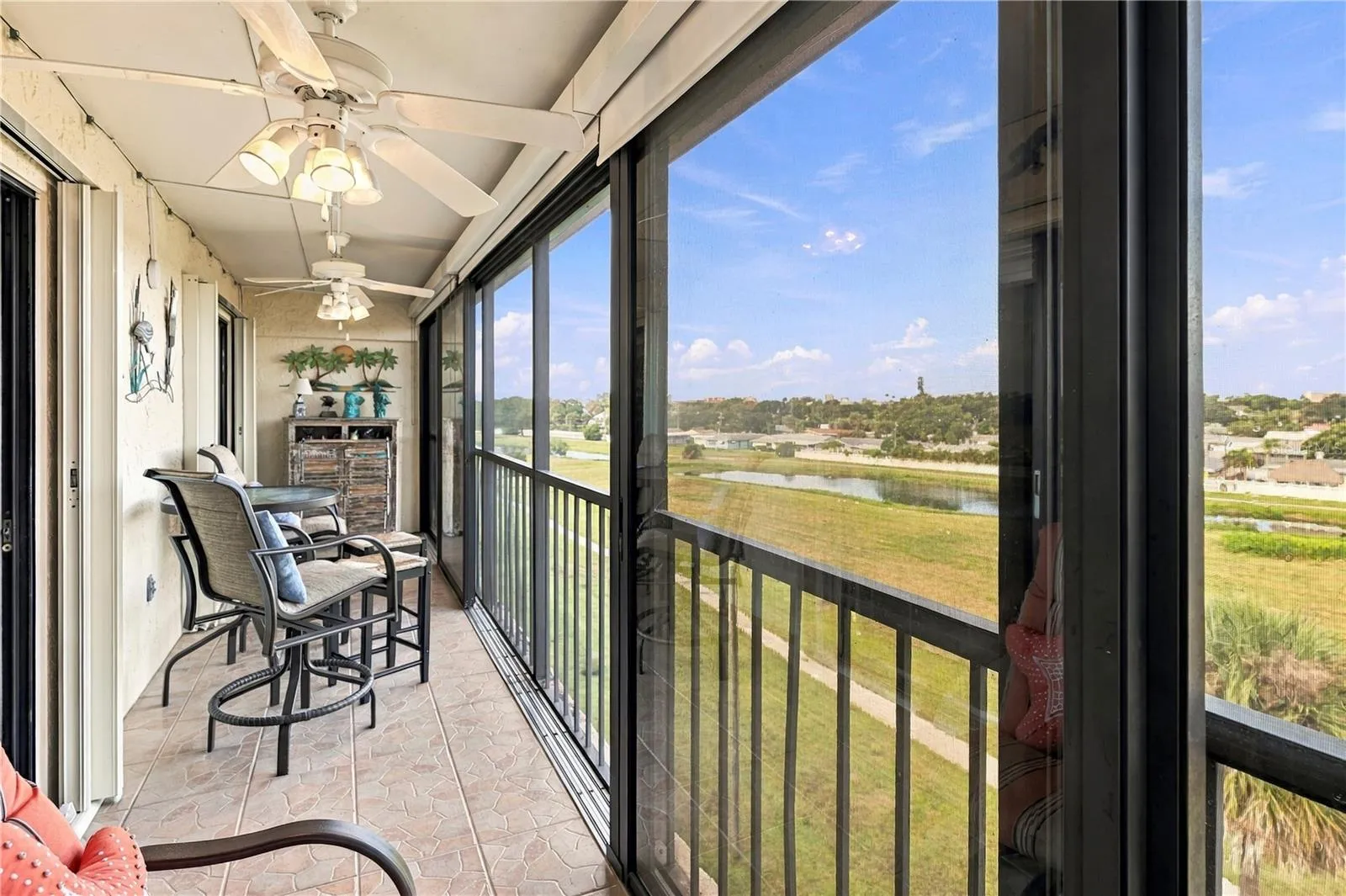 Glass sliding doors or open up to the screens.