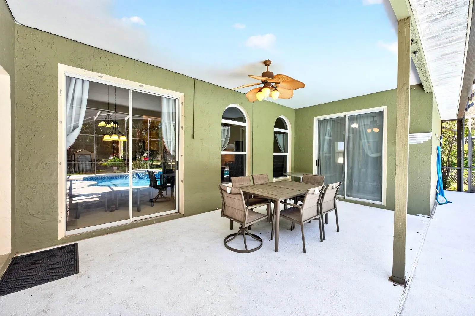Outside, the PRIVATE POOL and covered patio create the perfect place to unwind after a long day.