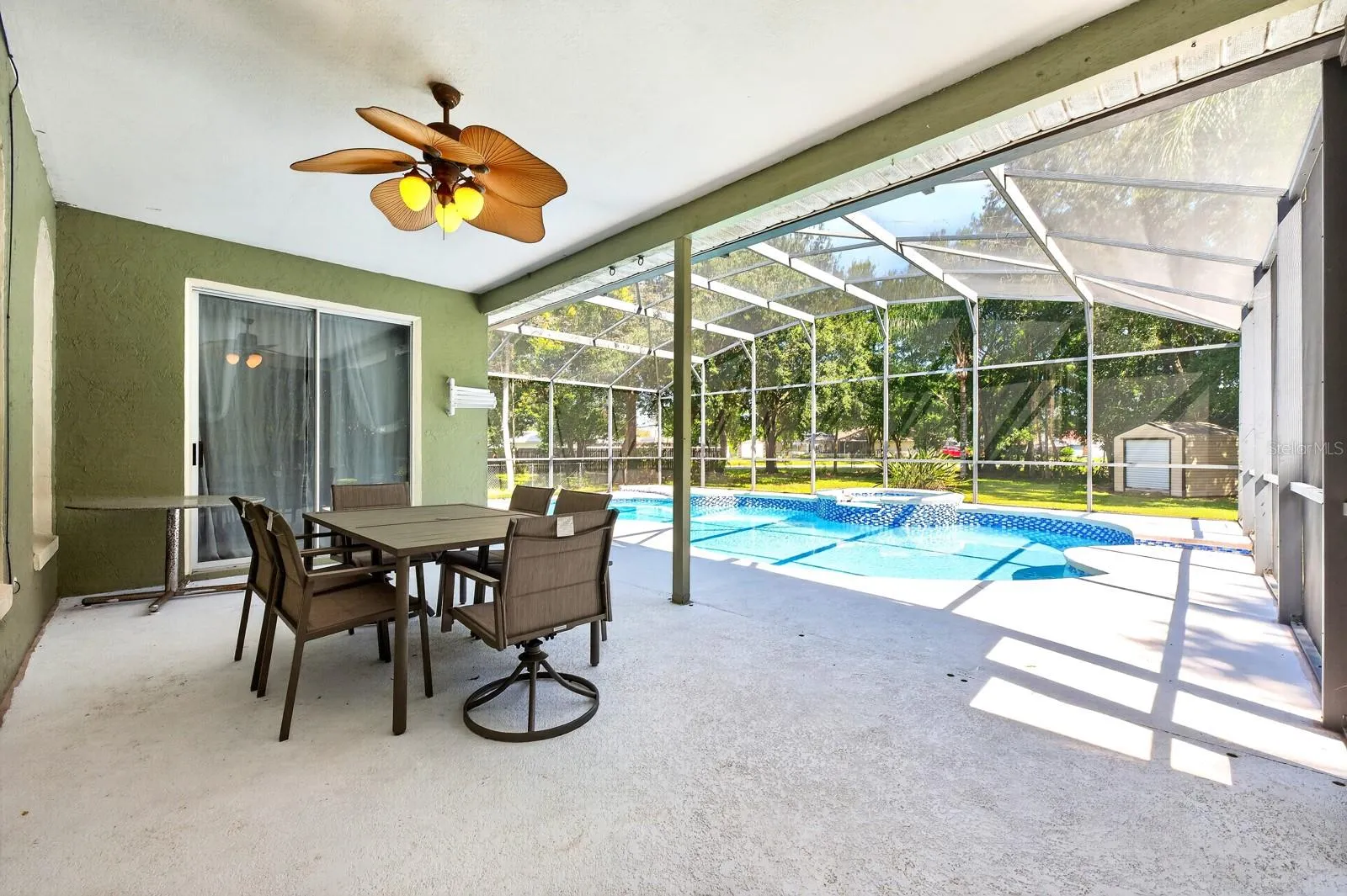 Outside, the PRIVATE POOL and covered patio create the perfect place to unwind after a long day.
