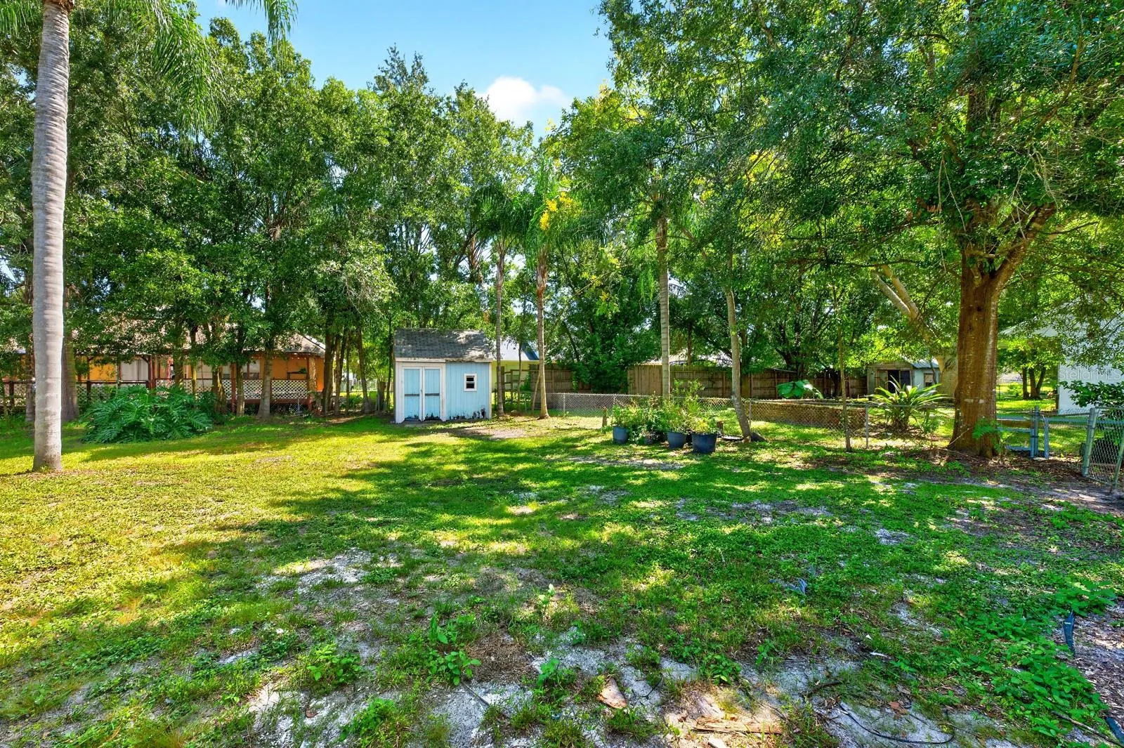 Whether you're relaxing poolside, hosting friends or simply enjoying the peaceful surroundings, there's plenty of room to make this backyard your own.