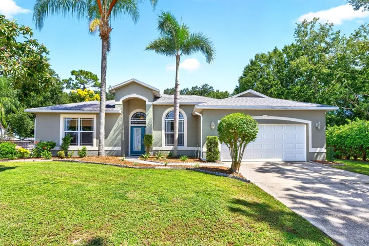Welcome to this BEAUTIFULLY MAINTAINED Canoe Creek Woods home in St. Cloud where space, privacy and RESORT-STYLE OUTDOOR LIVING come together.