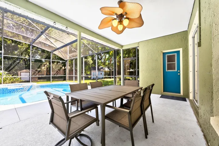 With a screened lanai this space is ready for everything from quiet mornings to poolside gatherings.