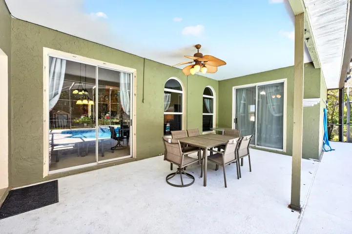 Outside, the PRIVATE POOL and covered patio create the perfect place to unwind after a long day.
