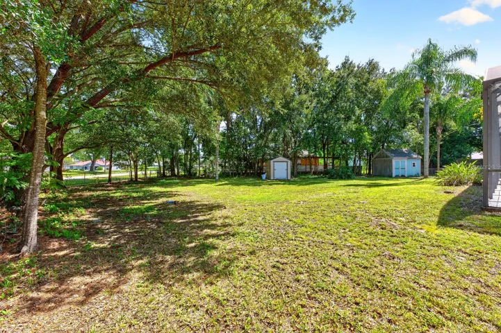 Outside, the generous yard offers plenty of room to garden, entertain, let pets play or simply enjoy the Florida sunshine.