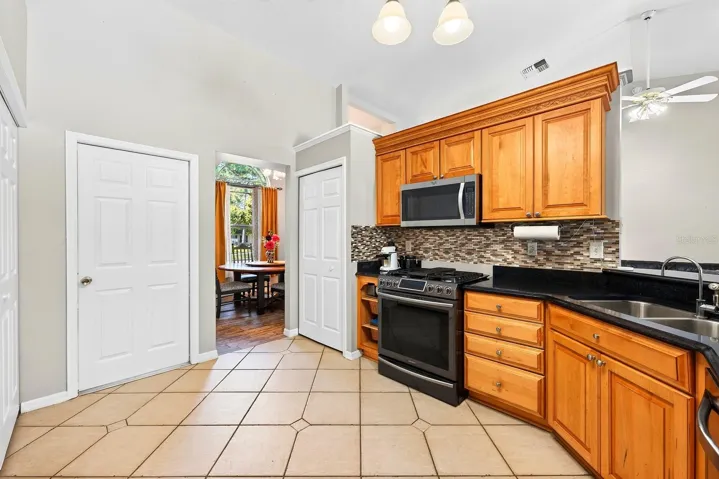 The Kitchen boasts a closet pantry and door to access the garage.
