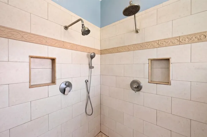 The walk-in shower with triple showerheads.