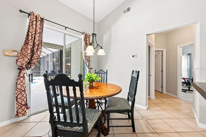 The Breakfast Nook overlooks the backyard with sliding door access.