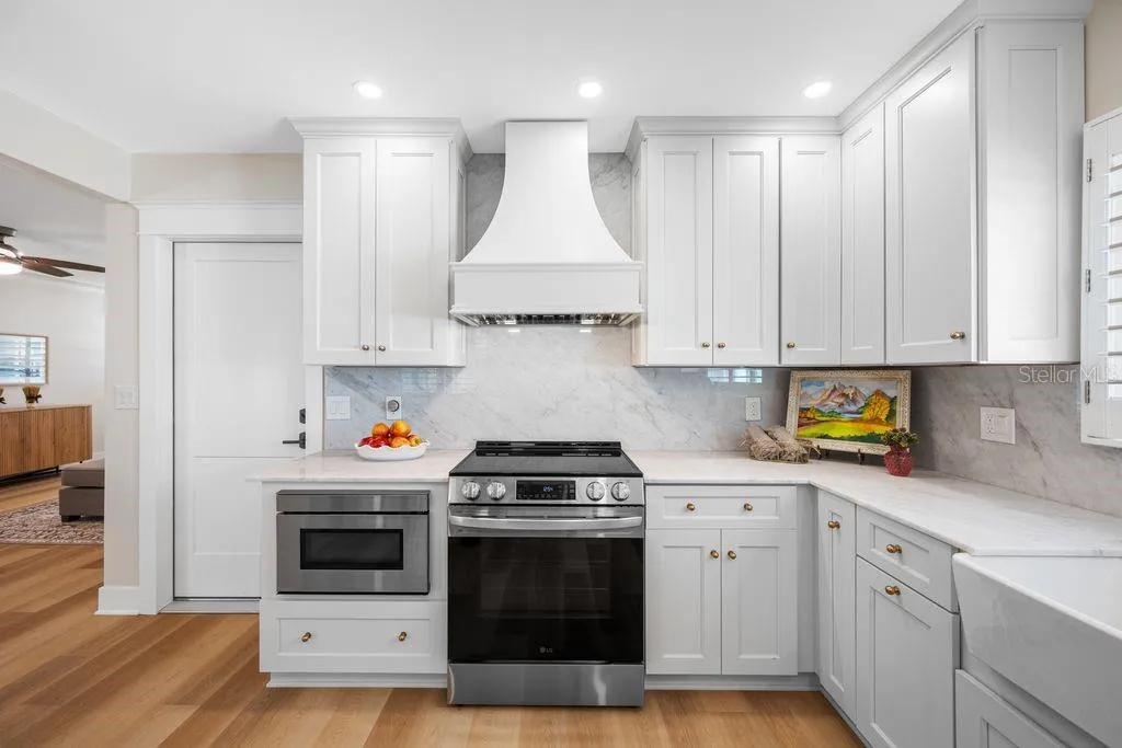 Under cabinet microwave, remote control range hood, range with convection oven - door to left is garage entrance