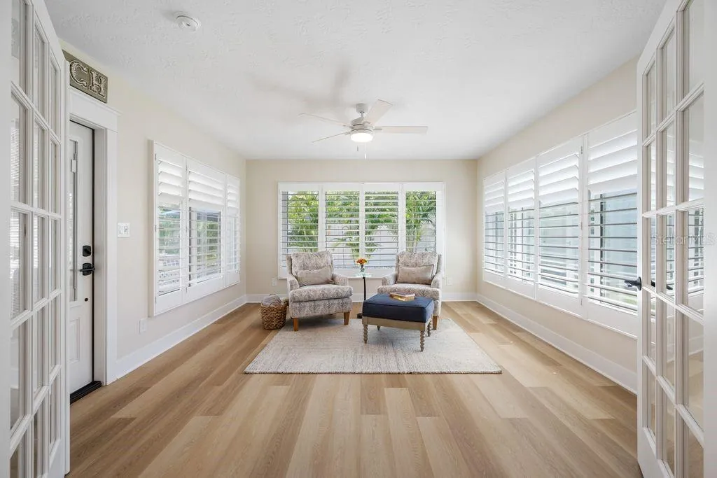 With Three Walls of Windows and Plenty of Natural Light - This Florida Room is Stunning!