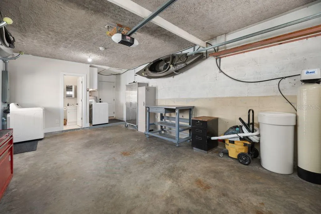 Garage - Showing Entrance to Full Bath in Garage - Washer &amp; Dryer and Water Softener Stay