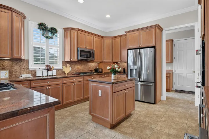 Full View of the Kitchen with Stainless Steel Appliances and Granite Counter Top