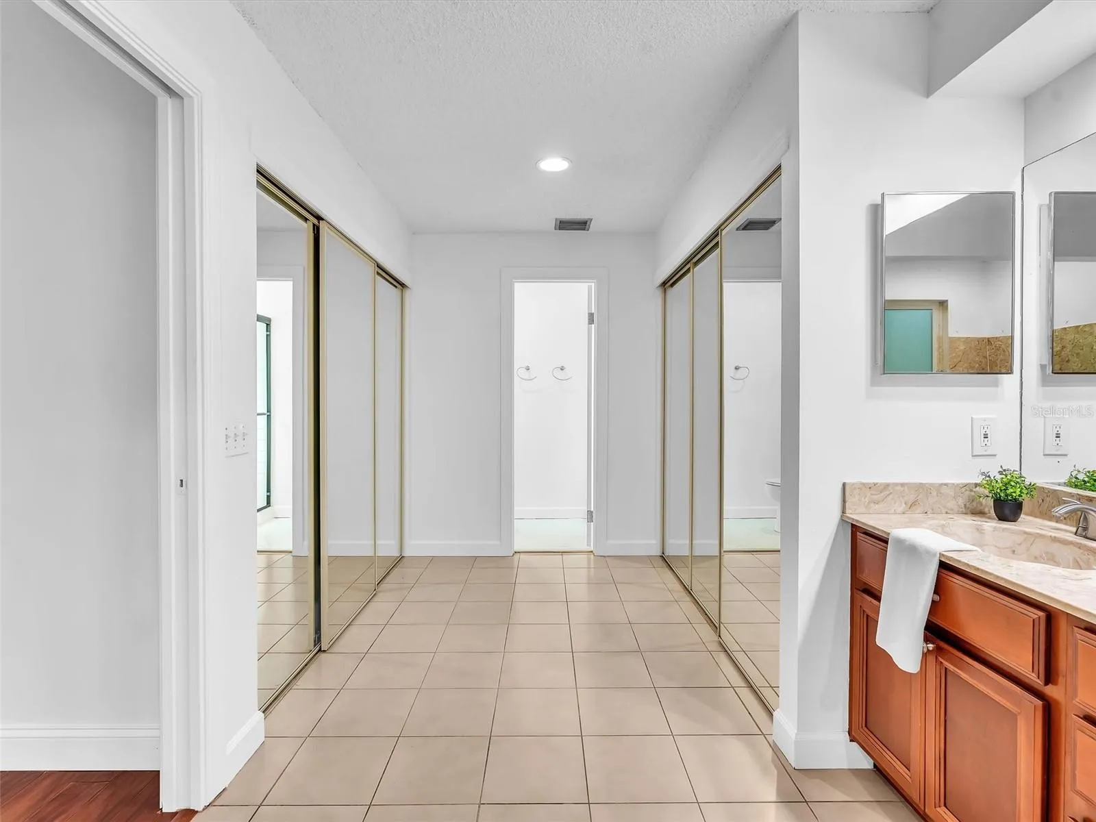 Dual Closets lead to the shower and water closet