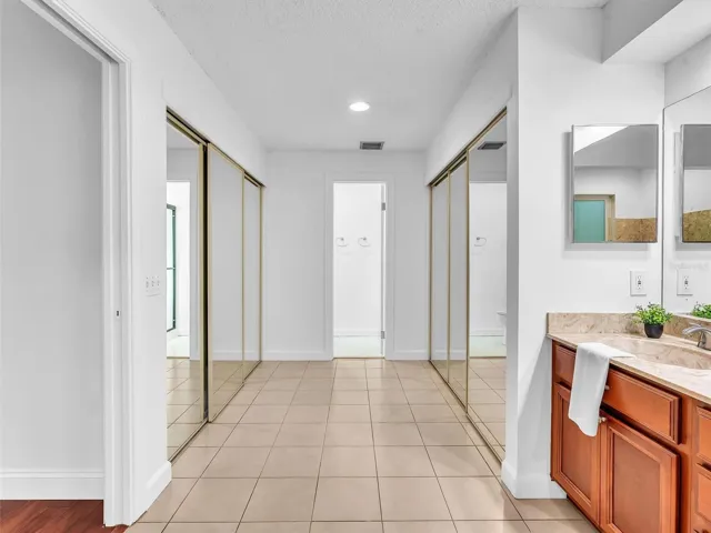 Dual Closets lead to the shower and water closet