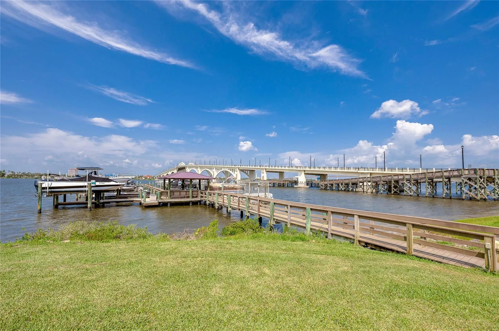 Expansive water views highlighted by a nearby bridge, creating a picturesque and relaxing backdrop.