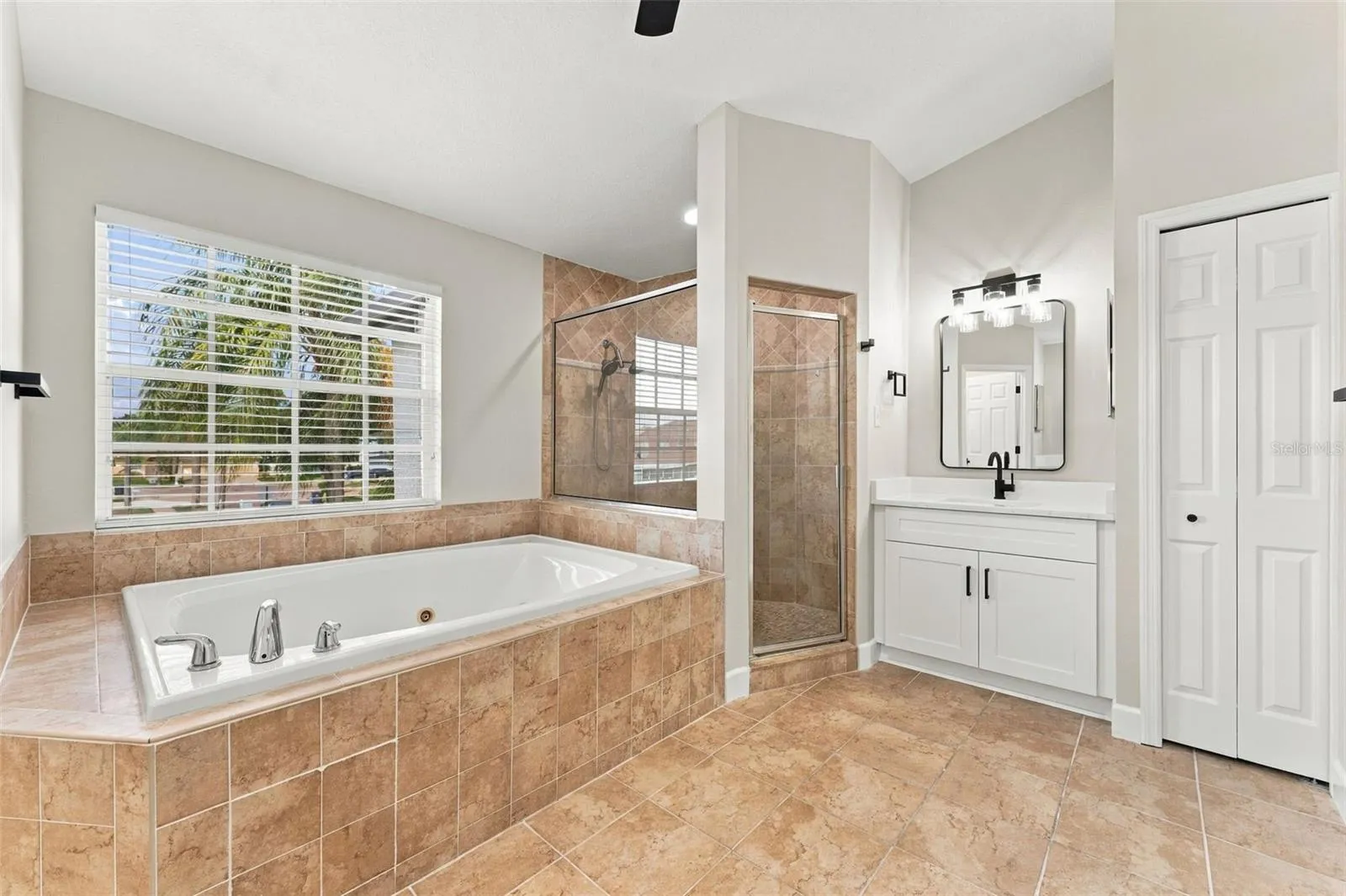 Large jacuzzi bathtub with separate shower stall