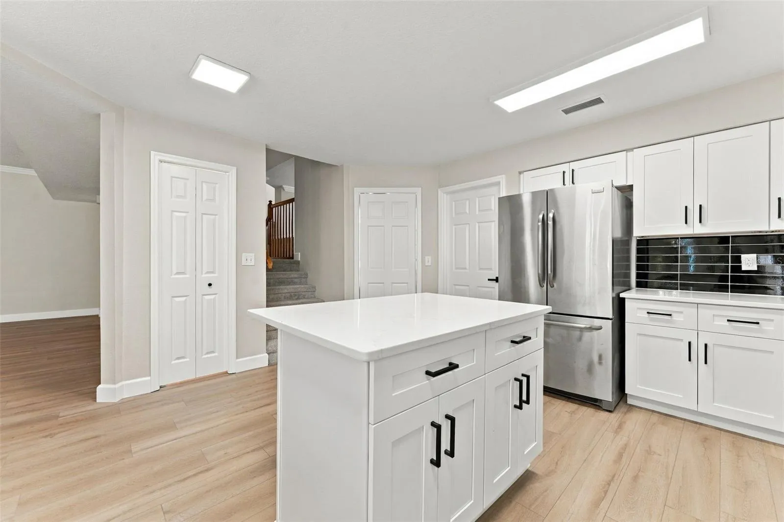 Kitchen island and closet pantry allow even more space for storage