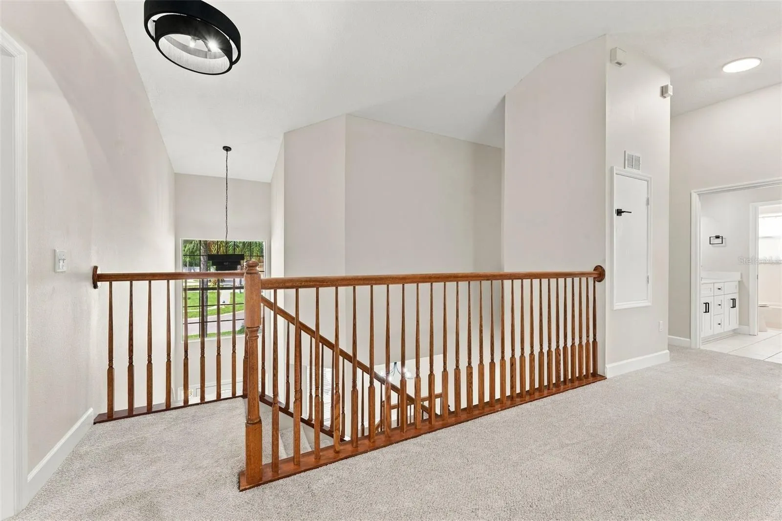At the top of the stairs you enter into the bonus room/loft area
