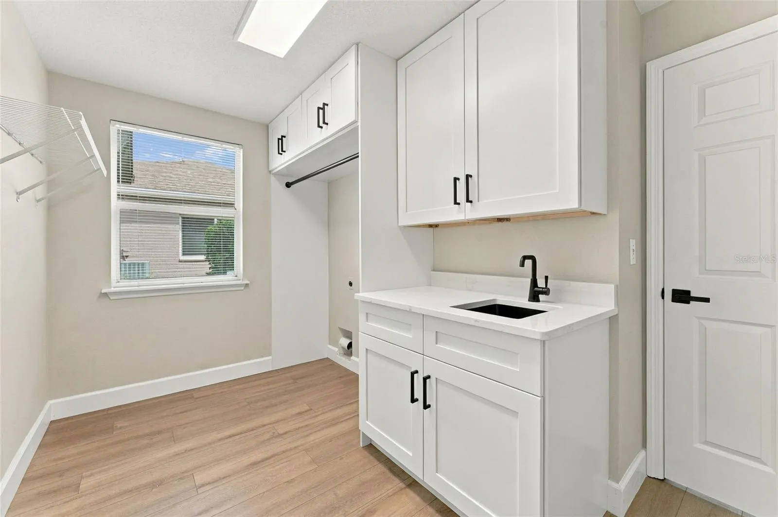 New cabinets. countertops and storage designed into your brand new laundry room