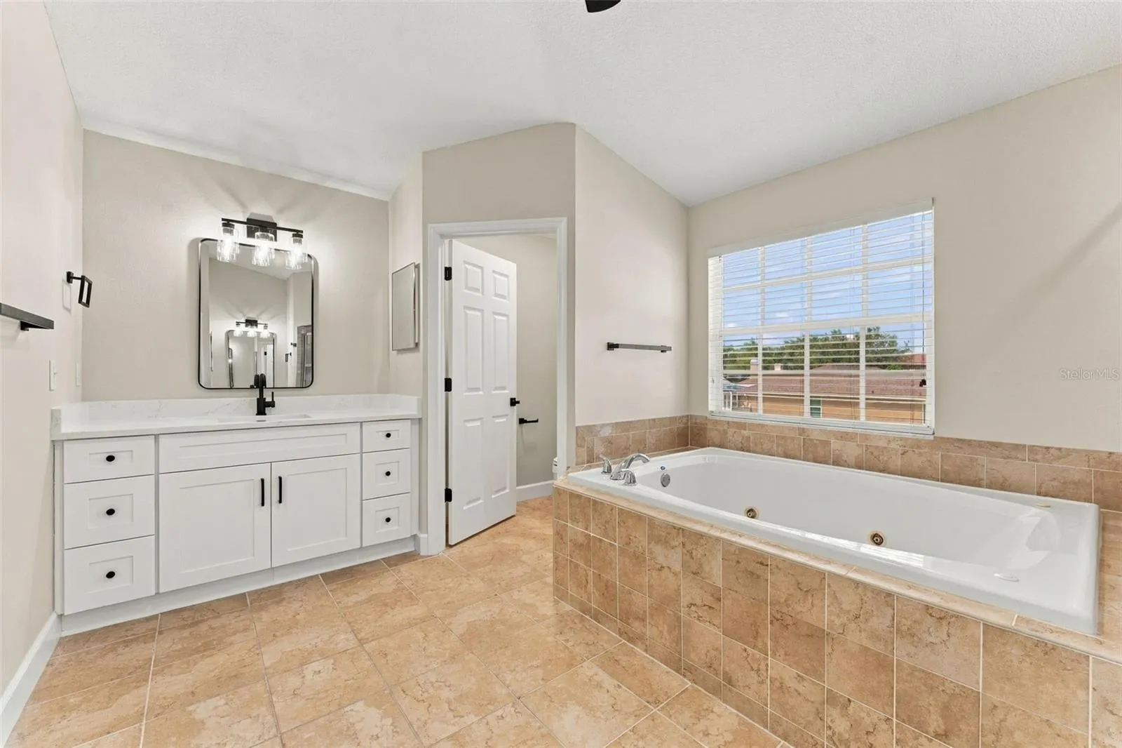 Primary bathroom with dual vanities